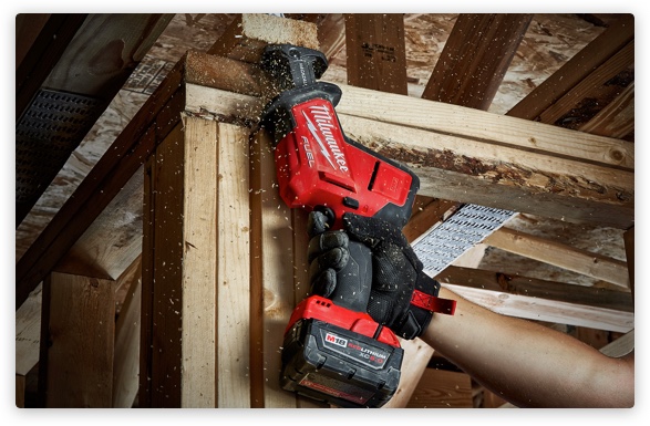 Nothing but HEAVY DUTY. Person using Milwaukee tool